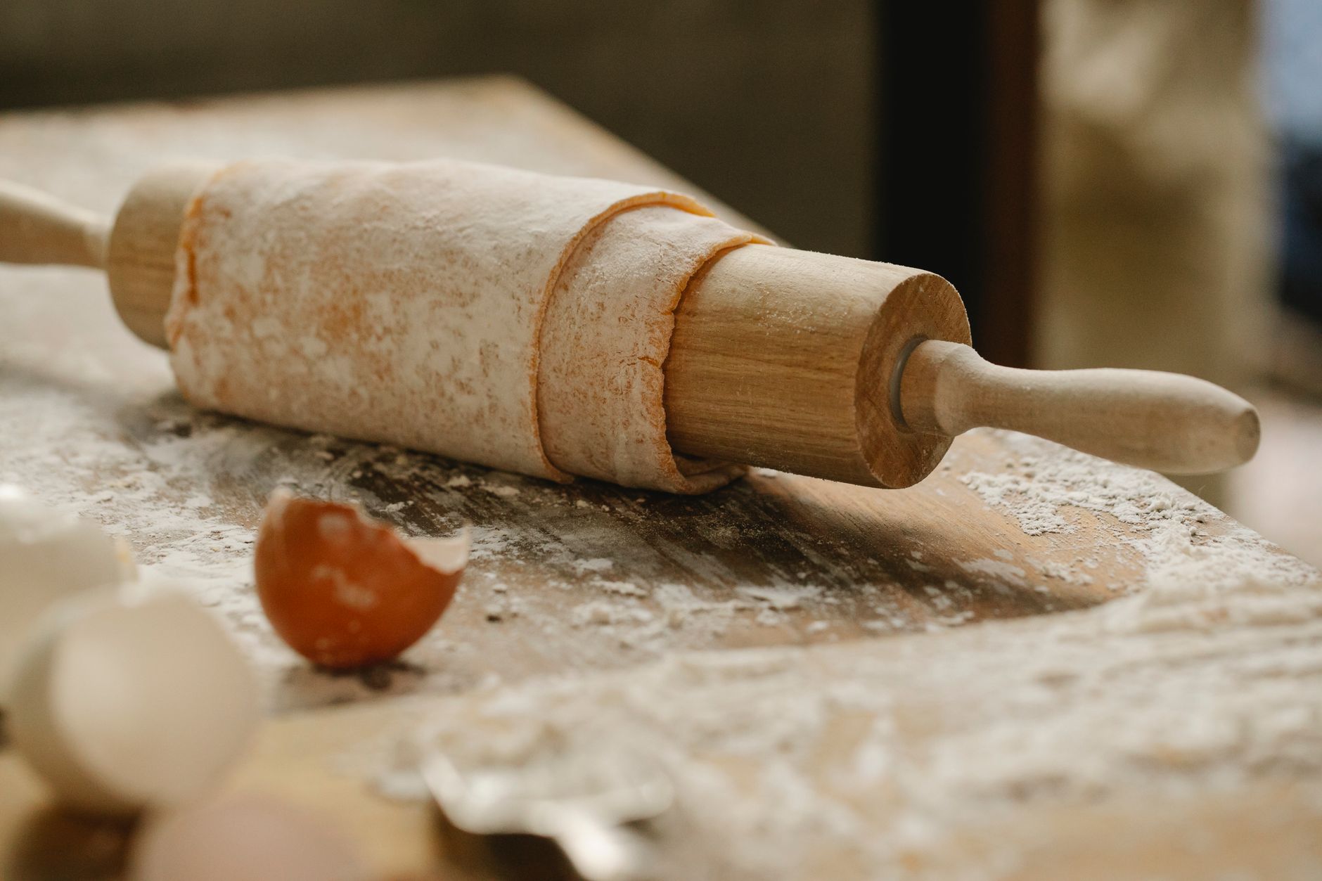 Dough being rolled out, filmed close