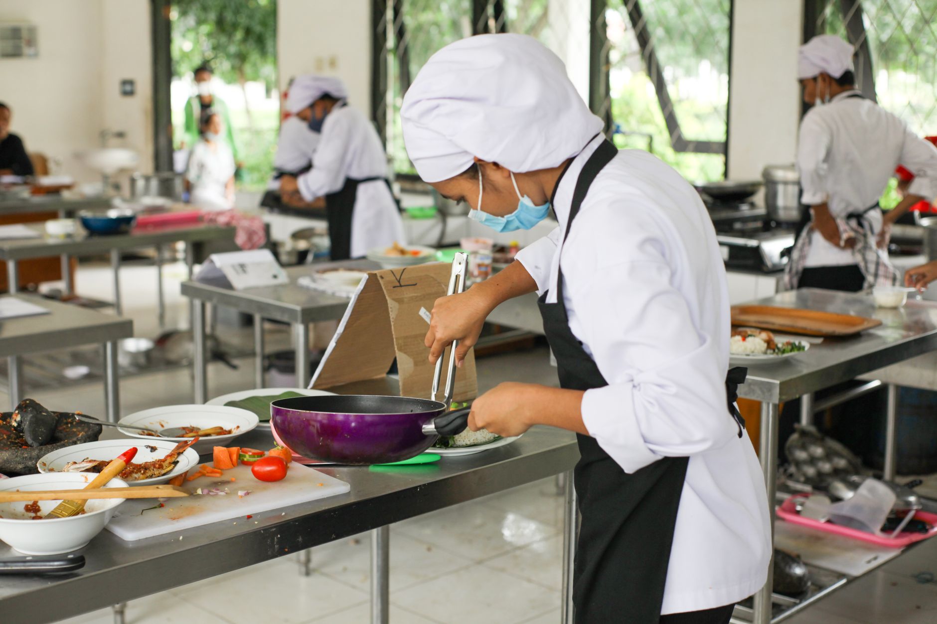 Students working at their stations in a teaching kitchen